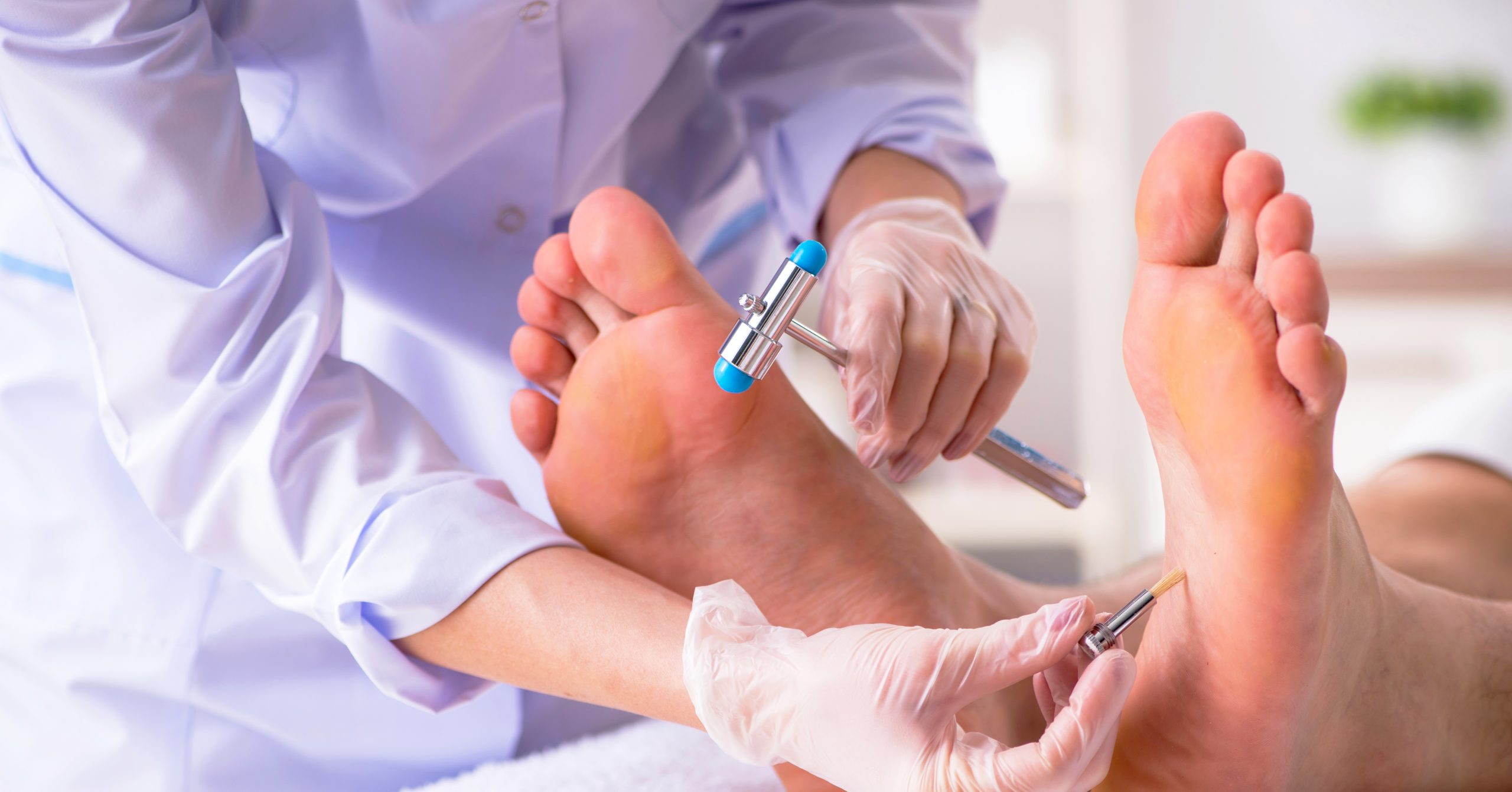 Podiatrist examining a patient's foot
